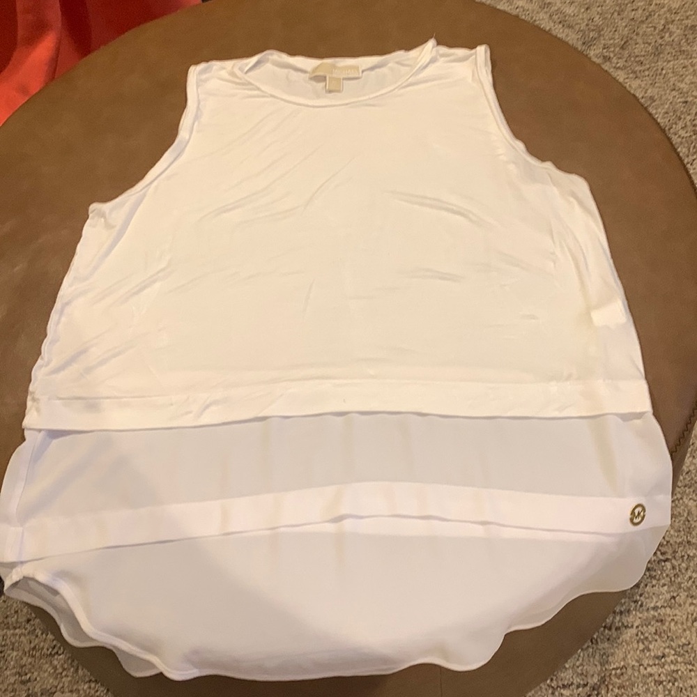 White sleeveless summer shirt.